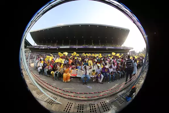 Yellow KKR flags came in handy as "Chinese hand-fans" on a hot day.