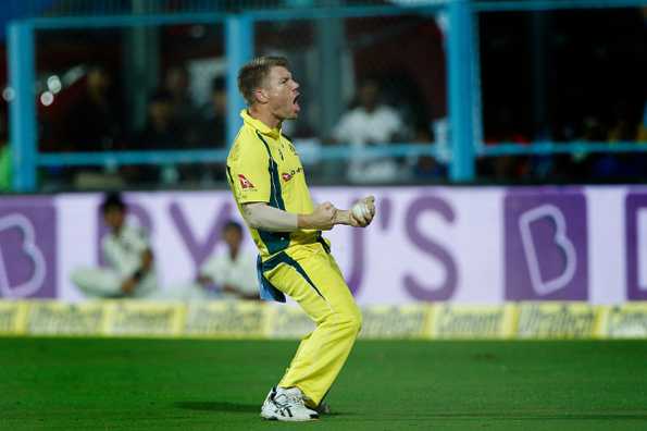 David Warner celebrates after taking Shikhar Dhawan's catch