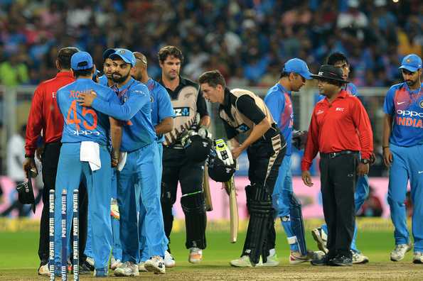 The game was reduced to eight-overs per side due to heavy rain.