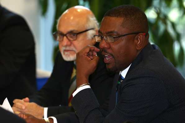 Dave Cameron (right) questioned the commitments of Kieron Pollard, Sunil Narine and Darren Bravo for making themselves unavailable for the world cup qualifiers