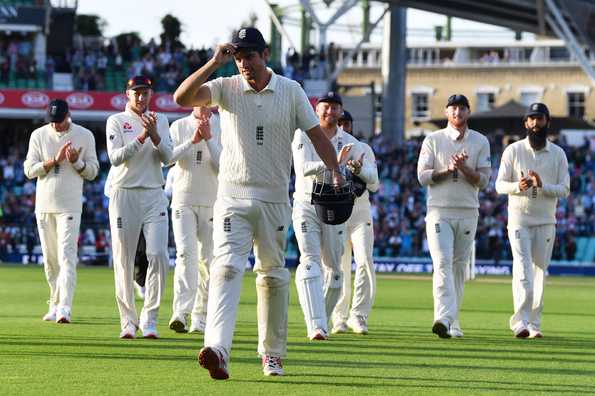 Cook walks off to cheers from his team-mates