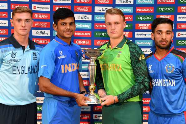 George Balderson of England, Priyam Garg of India, Bryce Parsons of South Africa and Farhaan Zakhiel of Afghanistan with the trophy