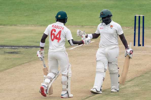 Prince Masvaure, Kevin Kasuza and Craig Ervine scored half-centuries to frustrate the visitors