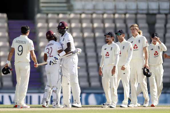 Holder and Campbell celebrate after getting West Indies over the line