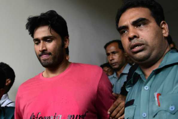 Bangladeshi cricketer Shahadat Hossain (centre) was arrested in October 2015 over allegations of beating his 11-year-old maid