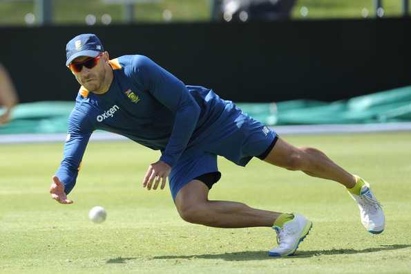 Faf du Plessis, South Africa's T20I skipper, dives to catch a ball during a practice session