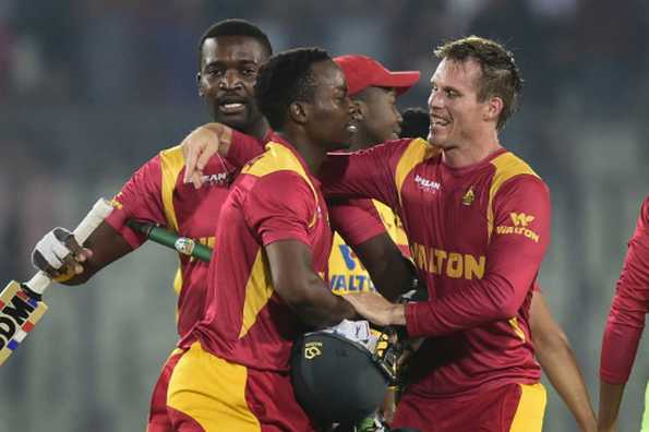 Neville Madziva and Malcolm Waller celebrate after helping their team to victory