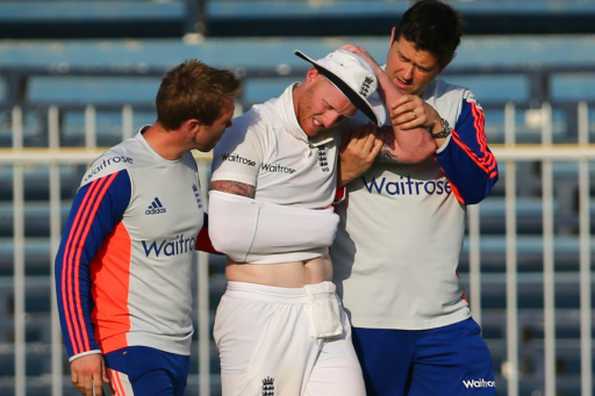 Medics help Ben Stokes after he injures his shoulder.