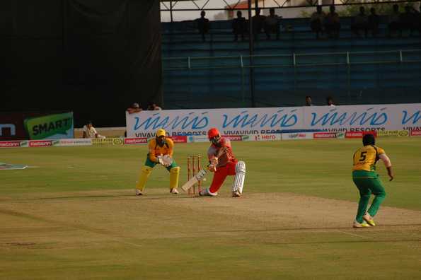 KP Appanna bowling to SP Manjunath as wicket-keeper Robin Uthappa looks on.