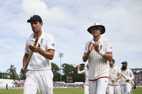 Alastair Cook and his team-mates walk off the field after securing a 169-run win in Cardiff.