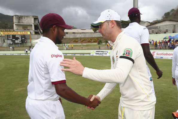 Ramdin shakes hands with Michael Clarke after West Indies' defeat in Dominica.