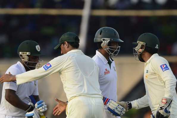 Pakistan players congratulating the Imrul Kayes (left) and Tamim Iqbal (right) after the end of Day 4