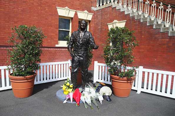 Tributes at the statue of Richie Beanud at the Sydney Cricket Ground on April 10.