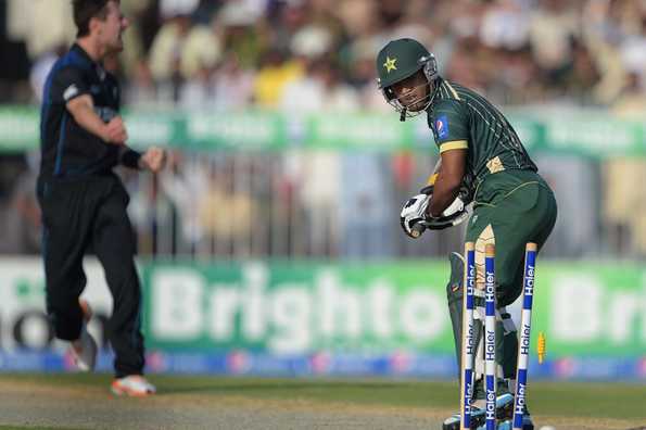 Asad Shafiq is bowled by Matt Henry (L).