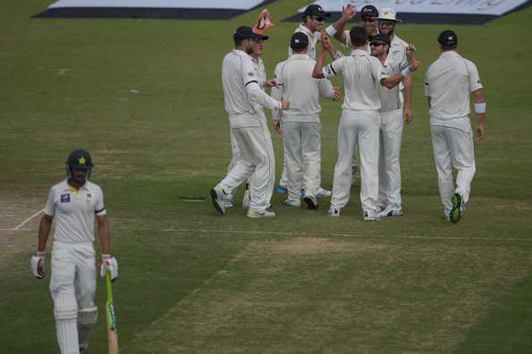 New Zealand cricketers celebrate after dismissing Shan Masood in the second Test