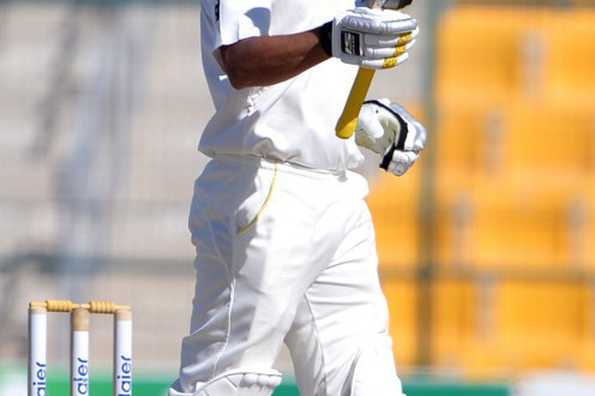 Azhar Ali raises his bat after registering his 17th Test fifty.