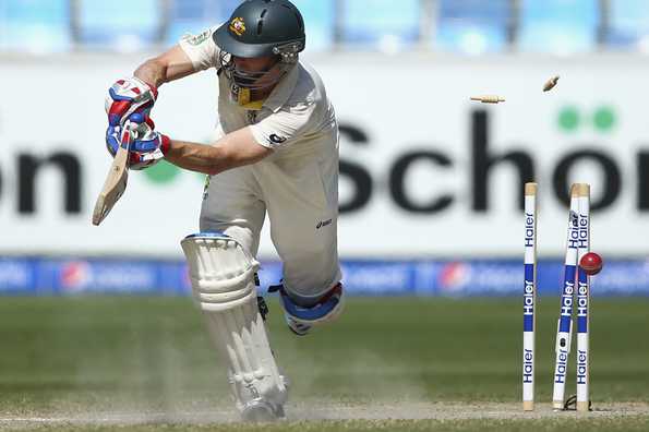 Chris Rogers is bowled by Imran Khan.