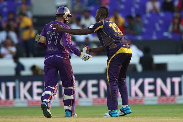 Andre Russell congratulates Shoaib Malik for his unbeaten knock.