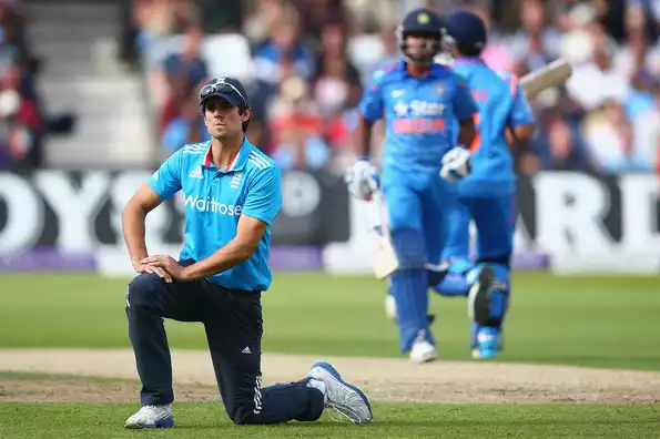 Alastair Cook shows his frustration as Suresh Raina and Ambati Rayudu of India run between the wickets.