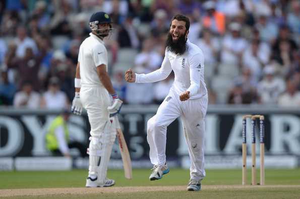 Moeen Ali of England celebrates dismissing Cheteshwar Pujara of India during day three of 4th Investec Test match between England and India at Old Trafford on August 9, 2014 in Manchester, England. 