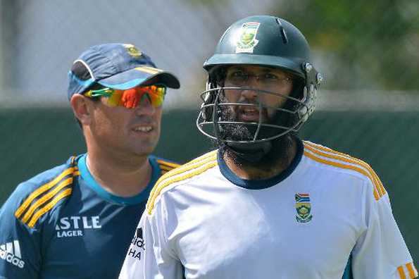 South Africa cricket team captain Hashim Amla (R) and team coach Russel Domingo pictured during a practice session at the R. Premadasa International Cricket Stadium in Colombo on July 23, 2014