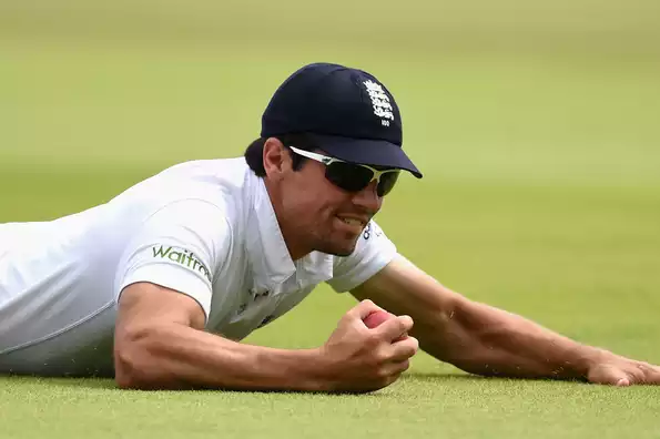 Alastair Cook takes a superb catch to send back Stuart Binny.