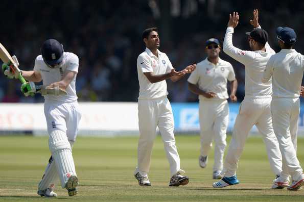 Bhuvneshwar Kumar of India celebrates with teammates after dismissing Sam Robson