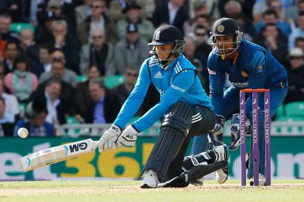 England?s Joe Root (L) plays a shot as Sri Lankan wicketkeeper Kumar Sangakkara looks on during their first One Day International (ODI) match, at The Oval cricket ground in London, on May 22, 2014