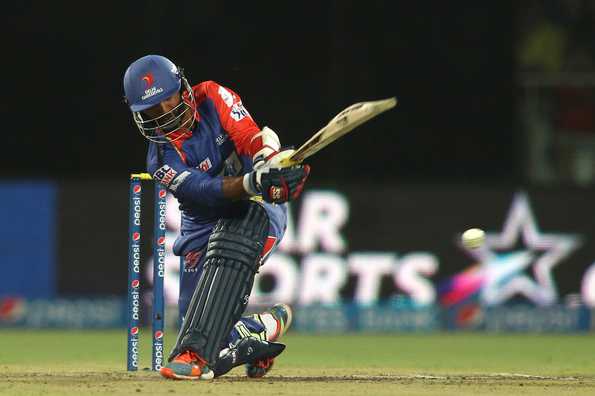 Dinesh Karthik of the Delhi Daredevils sweeps a delivery.