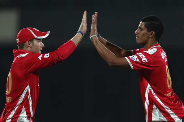 David Miller congratulates Beuran Hendricks of the Kings XI Punjab for getting rid of Jean-Paul Duminy of the Delhi Daredevils.