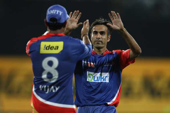 Murali Vijay and Imran Tahir celebrate a wicket.