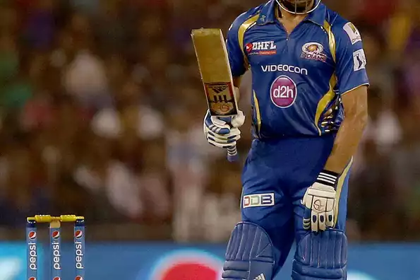 Rohit Sharma acknowledges the applause after scoring his half century.