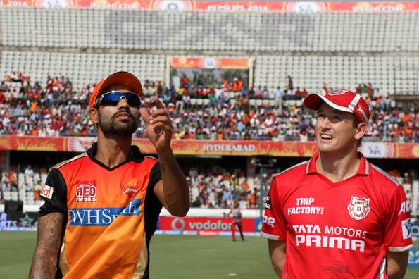 Shikhar Dhawan tosses the coin while George Bailey calls.