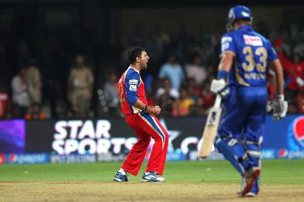 Yuvraj Singh celebrates after taking the wicket of Shane Watson.