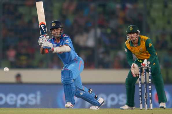 Ajinkya Rahane bats as Quinton de Kock looks on.