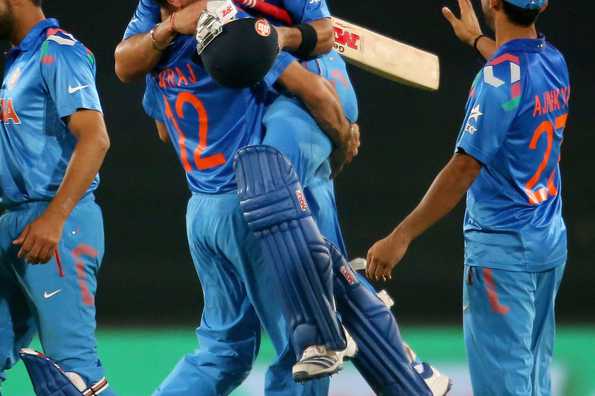 Virat Kohli of India is hugged by Yuvraj Singh after India won the semi-final.