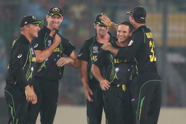 Brad Hodge is congratulated by his teammates after dismissing Rohit Sharma.