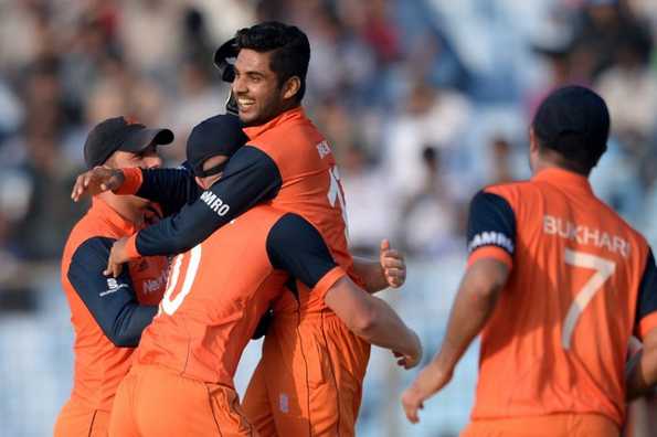 Netherlands bowler Ahsan Malik (2R) celebrates the wicket of unseen South Africa batsman David Miler with teammates during the ICC World Twenty20 tournament cricket match between South Africa and the Netherlands at The Zahur Ahmed Chowdhury Stadium in Chittagong on March 27, 2014. 