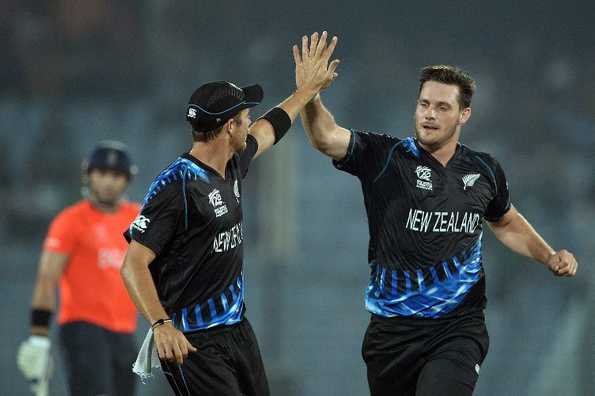 Mitchell McClenaghan celebrates the wicket of Michael Lumb.