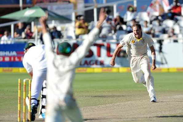 Australia's Ryan Harris celebrates as he takes the last wicket to win on day five of the third Test against South Africa in Capetown on March 5, 2014