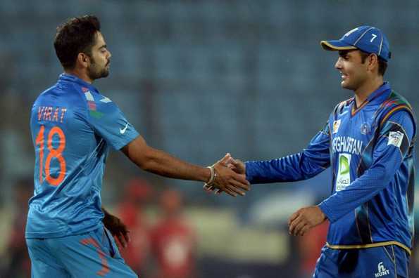 Virat Kohli shakes hand with Afghanistan captain Mohammad Nabi.