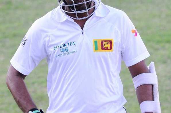 Sri Lankan batsman Dilruwan Perera leaves the field after being dismissed for 95.