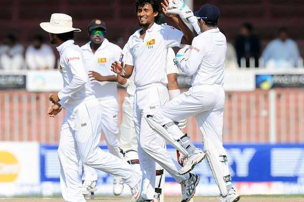 Lakmal celebrates with teammates after dismissing Pakistani batsman Ahmed Shehzad.