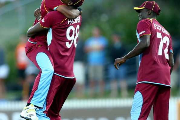 HAMILTON, NEW ZEALAND - JANUARY 08: Jason Holderof the West Indies (C) celebrates his runout of Kyle Mills of New Zealand during game five of the One Day International Series between New Zealand and the West Indies at Seddon Park on January 8, 2014 in Hamilton, New Zealand. 