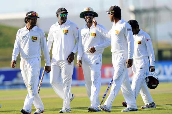 The Sri Lankan team leave the field after the first Test ended in a draw.