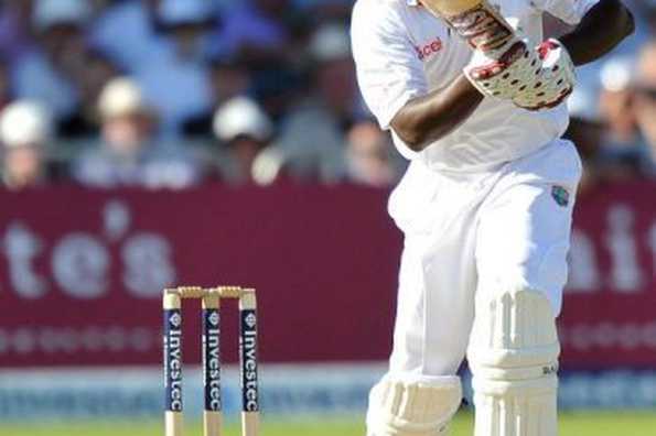 West Indies batsman Darren Sammy plays a shot against England. West Indies were 304 for six at stumps.