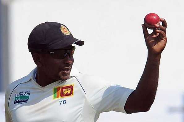 Sri Lanka's left-arm spinner Rangana Herath acknowledges the crowd after taking six wickets on the second day of the first Test against England in Galle on March 27, 2012. England bounced back after being spun out cheaply by Sri Lanka to leave the first cricket Test evenly poised at stumps at the Galle International Stadium on Tuesday.