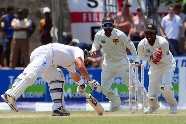 Sri Lanka wicketkeeper Prasanna Jayawardene (R) stumps England's Jonathan Trott (L) as Sri Lanka's captain Mahela Jayawardene looks on during the second day of the first Test in Galle on March 27, 2012. England bounced back after being spun out cheaply by Sri Lanka to leave the first cricket Test evenly poised at stumps.