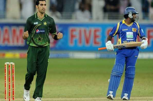 Pakistan's cricketer Umar Gul (L) celebrates after dismissing Sri Lanka's cricketer Seekkuge Prasanna during the third One Day International (ODI) match at the Dubai cricket stadium in the Gulf Emirate. Pakistani bowlers held their nerves to stop a threatening Sri Lankan team to win the third day-night international by 21 runs here on Friday to take a 2-1 lead in the five-match series.