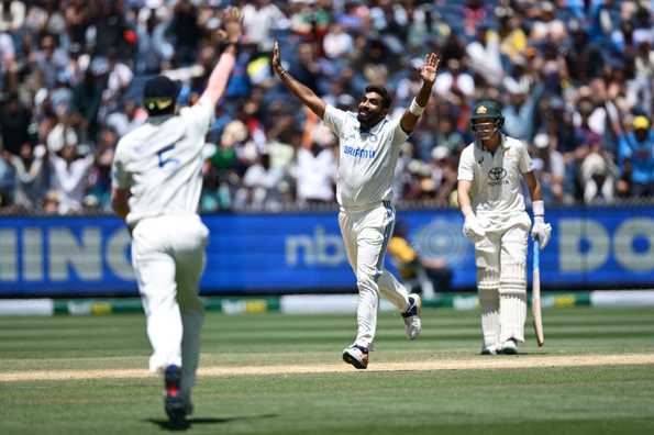 Jasprit Bumrah celebrates the fall of Mitchell Marsh